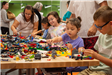 Close Up of Group Playing with Legos