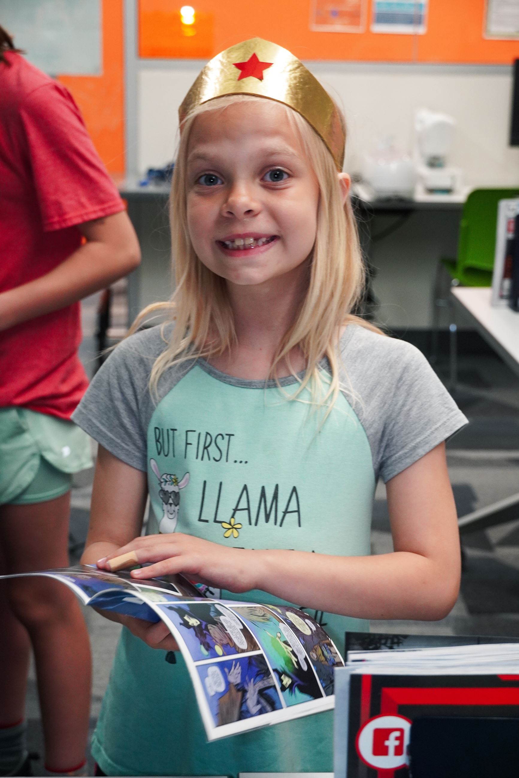 Child Smiling with Comic